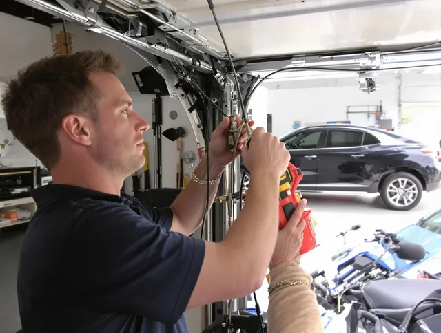 Grafton Garage Door Repair safety certified technician performing cable replacement in Grafton