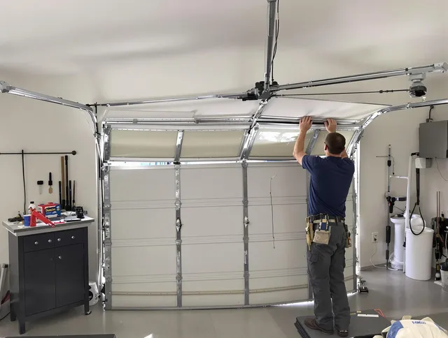 Grafton Garage Door Repair specialist performing precise section replacement on Grafton garage door
